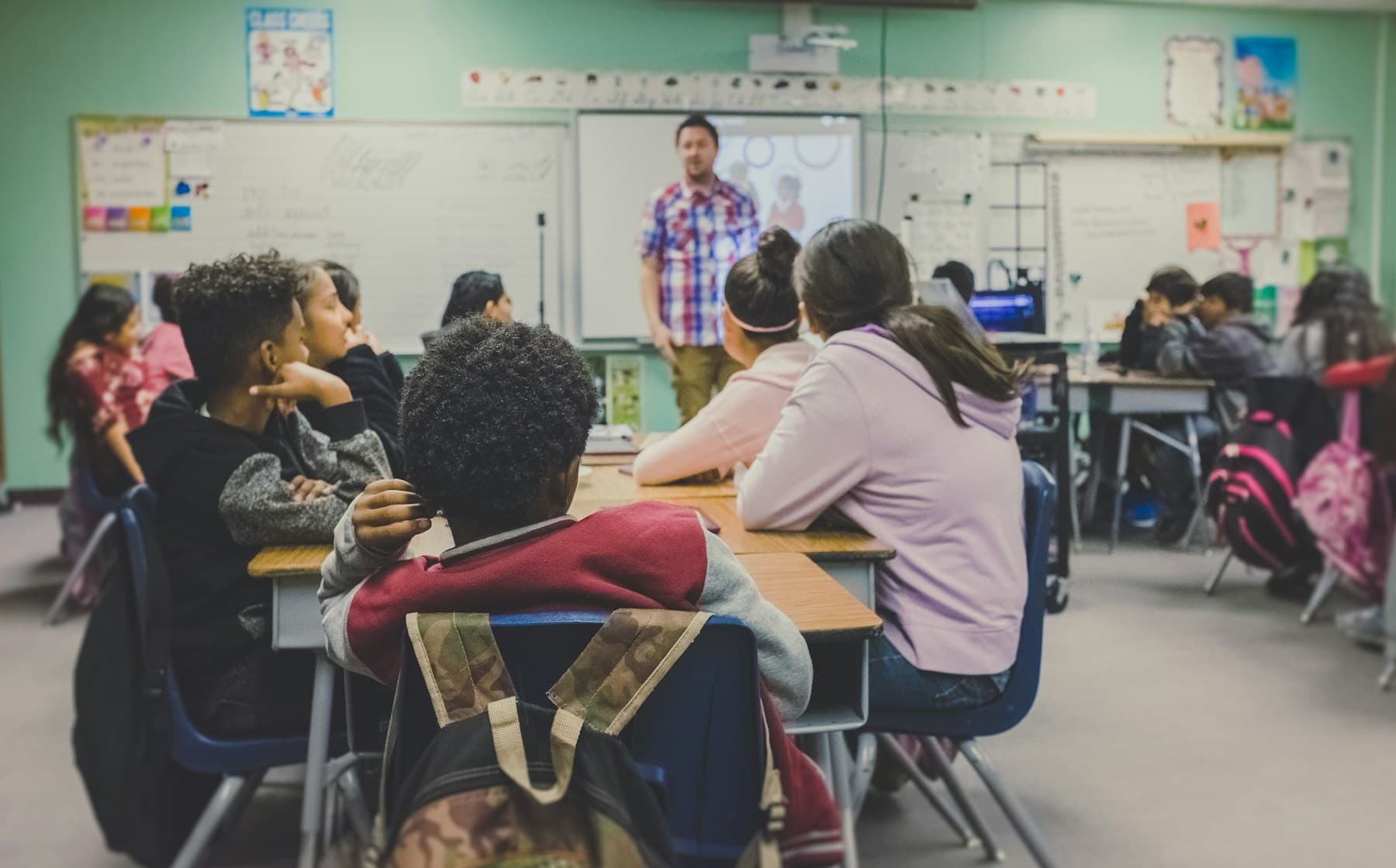 Students taking part in a teacher-led classroom lesson.